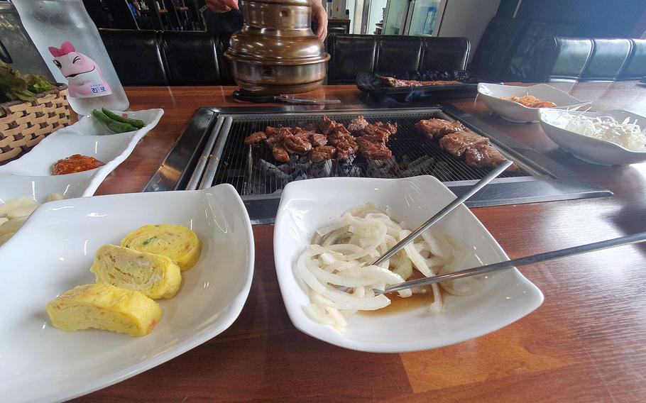 The atmosphere at Korean BBQ in Pyeongtaek, South Korea, is welcoming and the staff is attentive. 