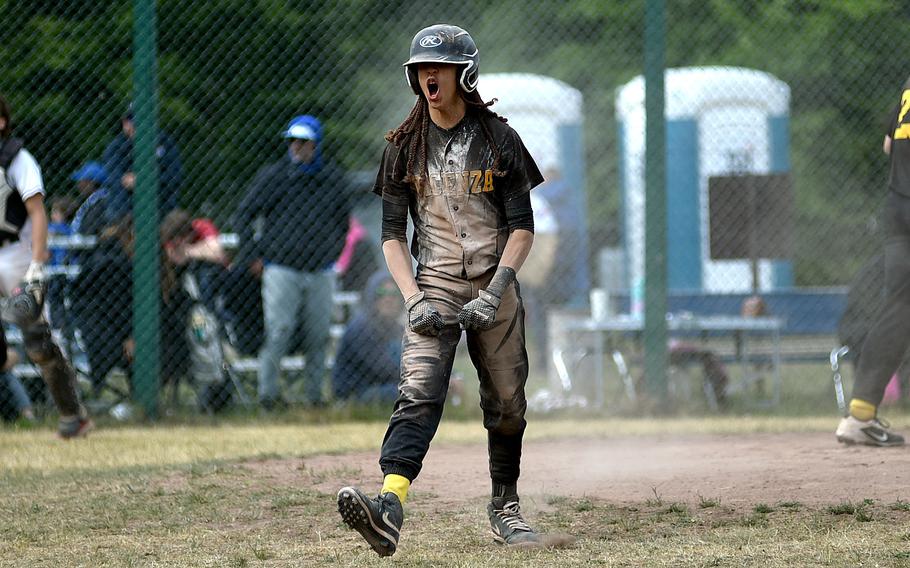 Vicenza senior Jace Herron celebrates after scoring during the Division II/III final against Naples at the 2025 DODEA European baseball championships on May 23, 2025, at Southside Fitness Center on Ramstein Air Base, Germany.