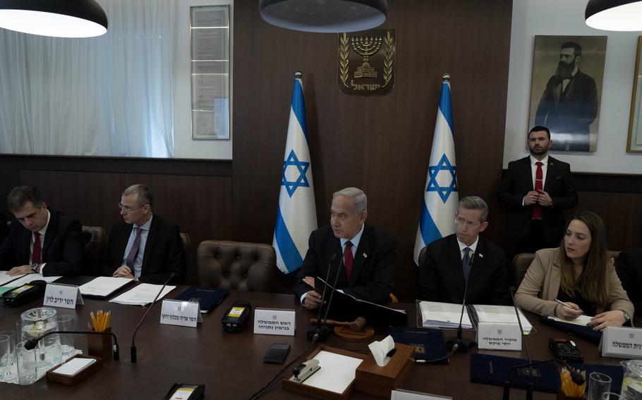 Israel’s Prime Minister Benjamin Netanyahu, center, chairs the weekly cabinet meeting in Jerusalem, Sunday, Jan. 22, 2023.