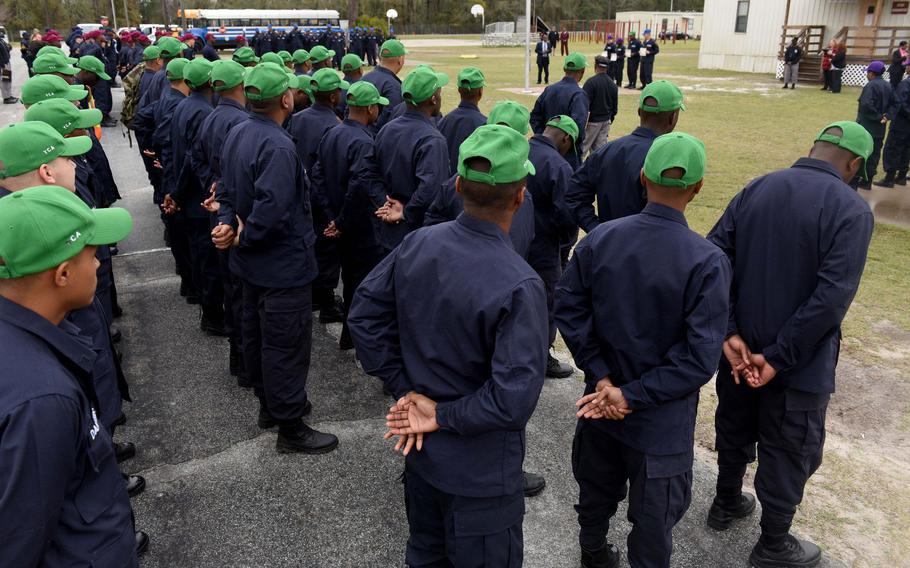 Cadets at the Fort Stewart Youth Challenge Academy stand in formation during a campus tour in February 2020. An AJC investigation in 2020 found the state-run boot camp’s adult platoon instructors, known as cadre, physically abused teenage cadets and sexually harassed female staff. The YCA program offers a quasi-military experience for teens, age 16 to 18, dividing them into platoons. The program’s Fort Gordon camp made news in October 2022 when a massive brawl between different platoons caused leaders to shut down the class and send the cadets home.