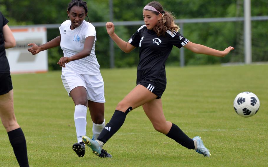 Marymount’s Rewina Haile , left, clears the ball in front of Vicenza’s Natalia Lopez in a Division II game at the DODEA-Europe soccer finals at Reichenbach-Steegen, Germany, May 21, 2024. Vicenza won 3-0. 