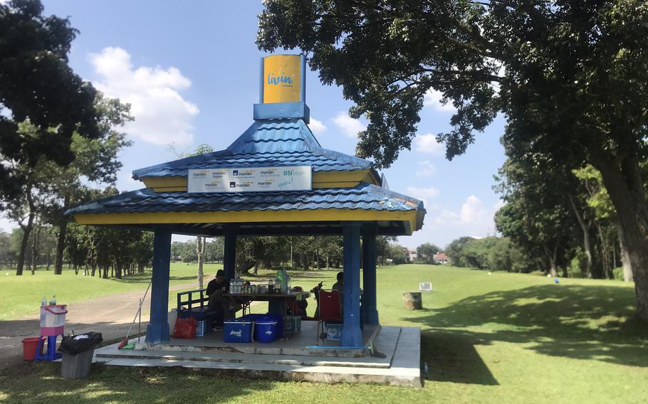 Locals sell snacks and drinks at Palembang Golf Course on Sumatra in Indonesia.