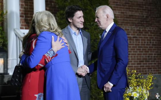 President Joe Biden and first lady Jill Biden are greeted by Canadian Prime Minister Justin Trudeau and his wife Sophie Gregoire Trudeau at Rideau Cottage, Thursday, March 23, 2023, in Ottawa, Canada.