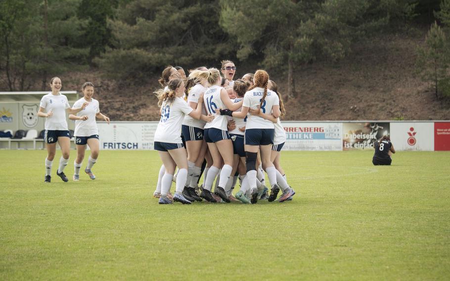 The Black Forest Academy Falcons celebrate their 3-0 win against the Vicenza Cougars in a surprising upset that gives them a seat at the finals during the 2025 Division II DODEA European championships at Reichenbach-Steegen, Germany on May 21, 2025.