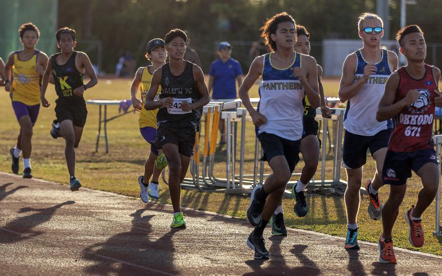 Guam High senior Alex Rink, second from right, stays on the shoulder of Okkodo senior Jadrian Juico during Monday's All-Island meet. Rink took third in the 800 and 1,500 and second in the 3,200. The Panthers boys won the team title for the fifth straight year and the girls for the third straight year.