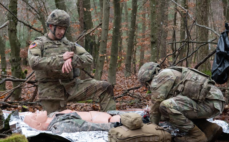 Two American soldiers participate in a medical competition.