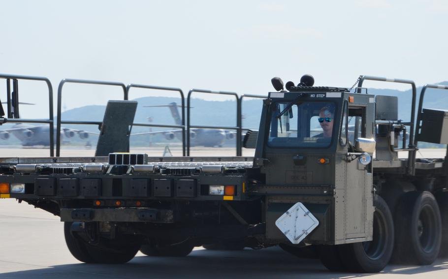 Airman 1st Class Ryan Joy drives a Tunner 60K aircraft cargo loader around a course at Ramstein Air Base on July 23, during the 721st Aerial Port Squadron Multi-Capable Airmen Rodeo. Joy, a ramp services agent with the 721st APS, has been driving loaders for two years, but "not as pedal-to-the-metal" as during the rodeo, he said.