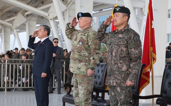 South Korean Defense Minister Lee Jong-sup, left, U.S. Forces Korea commander Gen. Paul LaCamera and South Korean Gen. Ahn Byung-seok attend the opening ceremony of the Republic of Korea-United States Combined Forces Command headquarters in Camp Humphreys, South Korea, Nov. 15, 2022. 