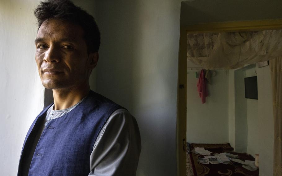 Abdul Rashid Shirzad poses at his home in Kabul, Afghanistan. 