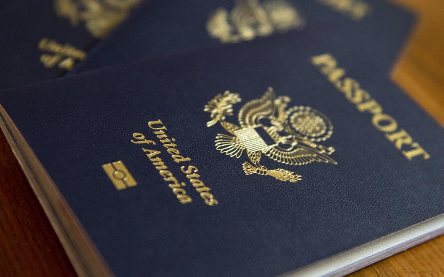 U.S. passports lie on a table.