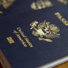 U.S. passports lie on a table.