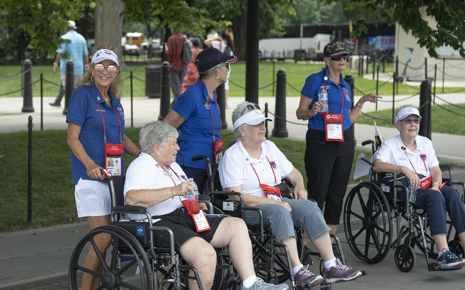 Honor Flight participants wait for the arrival of a Marine Corps drill team near the Lincoln Memorial on the National Mall in Washington, D.C., on Tuesday, May 31, 2022. Guests of honor in wheelchairs are from left, Army veteran Connie Plotkin, Air Force veteran Dixie Thalwitzer and Navy veteran Nancy Atkinson.