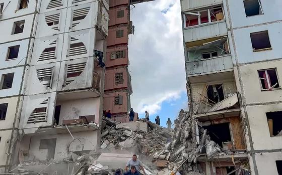 In this photo taken from video released by Belgorod regional governor Vyacheslav Gladkov’s Telegram channel on Sunday, May 12, 2024, Russian emergency services work at the scene of a partially collapsed block of flats authorities said was hit during an attack by Ukrainian shelling, in Belgorod, Russia. (Belgorod Region Governor Vyacheslav Gladkov Telegram channel via AP)