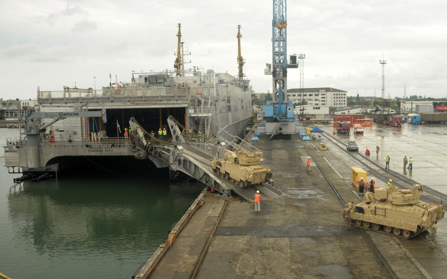 U.S. soldiers load equipment at the Georgian port of Poti in 2018. Russia is planning to build a naval base on the Black Sea coast of Georgia’s breakaway Abkhazia region, according to media reports.