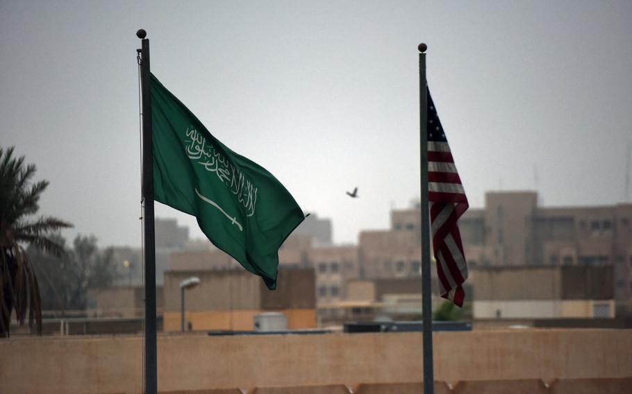 The Saudi and U.S. flags fly in Saudi Arabia in 2016. The U.S. was lax in its oversight of more than $54 billion in military aid to Saudi Arabia and the United Arab Emirates for the war in Yemen, according to a report released Wednesday by the Government Accountability Office.