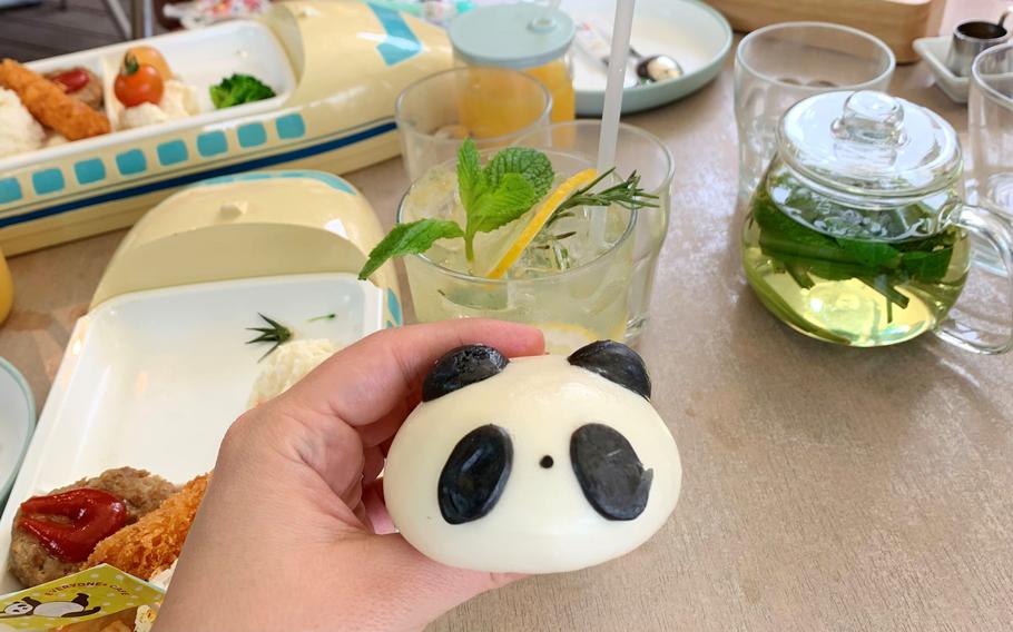 A panda-shaped steamed bun filled with sweet red bean paste is included with the kids set from Everyones Cafe inside Ueno Park in Tokyo. 