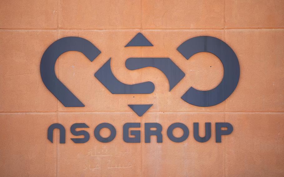 A logo adorns a wall on a branch of the Israeli NSO Group company, near the southern Israeli town of Sapir, Aug. 24, 2021.  The FBI  acknowledged In a statement Wednesday, Feb. 2, 2022, that the agency had tested spyware made by the NSO group