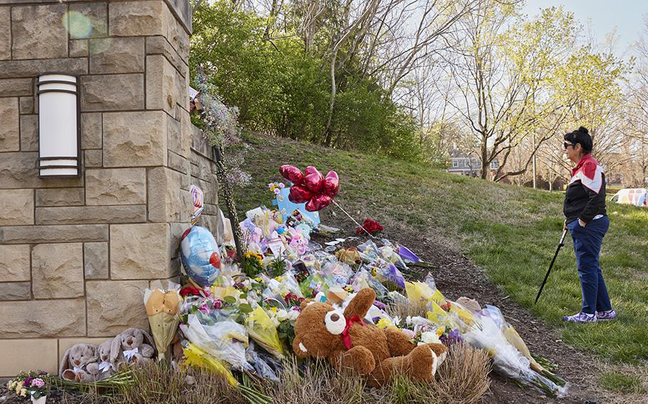 A women visits the makeshift memorial at the Covenant School the day after Monday’s shooting. 