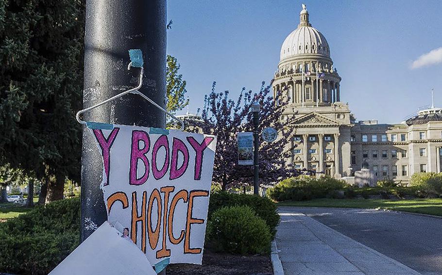 A sign taped to a hanger hangs near the Idaho Capitol in Boise after protests against the state’s new abortion laws, which effectively banned the procedure. 