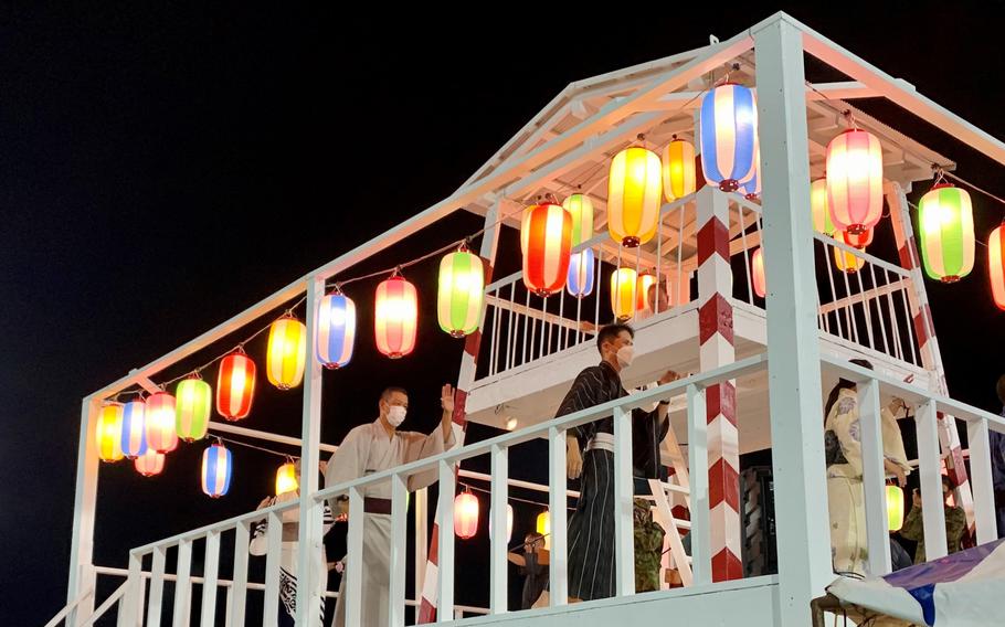 Bon Odori dancers wear masks during a festival at Camp Zama, Japan, Saturday, Aug. 6, 2022.