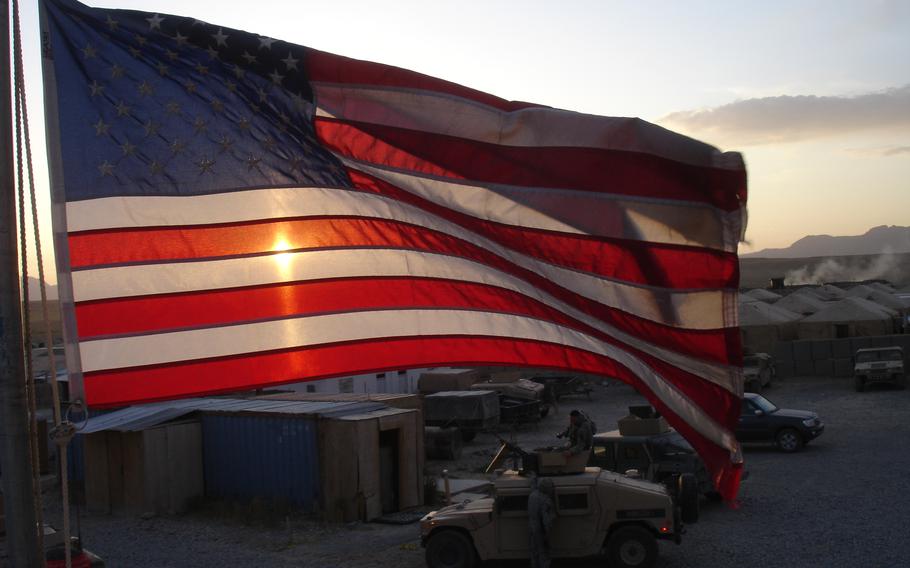 The U.S. flag flies over Forward Operating Base Lagman in Qalat, Afghanistan, in 2007. A former U.S. military contractor pleaded guilty this week to bribery and visa fraud in his management of millions of dollars worth of U.S.-funded reconstruction contracts in Afghanistan.