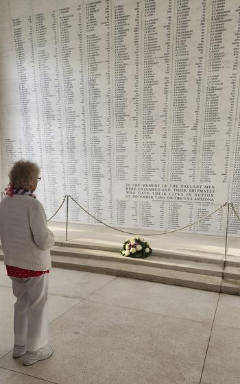 A woman pays respects at the USS Arizona Memorial