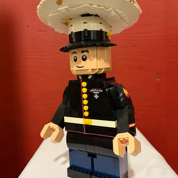 A LEGO Marine figure in dress uniform and hat.