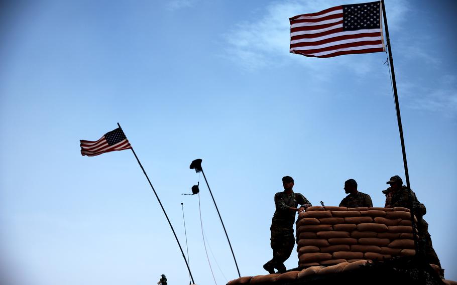 Soldiers deployed to At-Tanf Garrison in Syria watch for the impact of an 81 mm mortar from an observation point during an exercise in 2020.