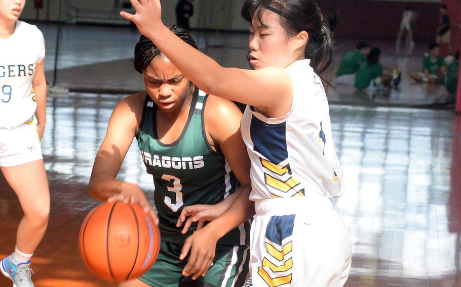 Kubasaki's Peyton Wilcox looks for room against the Taipei American defense during Saturday's Okinawa-American Friendship Tournament pool-play game. The Tigers won 41-20.