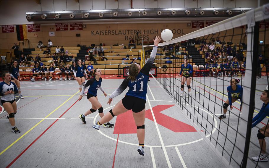 Brussels Brigand Raegan Cayce adeptly pushes the ball over the net during their match against the Sigonella Jaguars at the DODEA Division III European volleyball semifinals on Oct. 27, 2023, in Kaiserslautern, Germany.