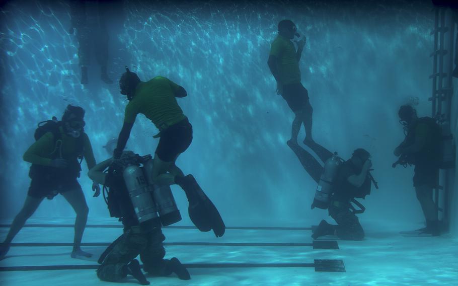 A U. S. Air Force Combat Dive Course instructors test trainees on one-man drills at Naval Support Activity Panama City, Fla, in August 2019. The U.S. Air Force has approved a new badge for combat divers that replaces the Navy scuba badge. 