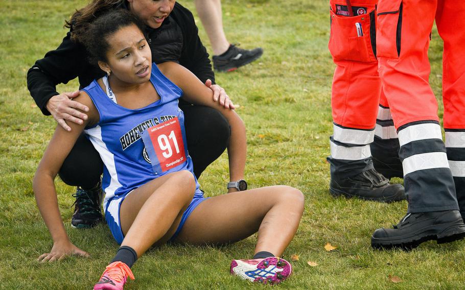 Hohenfels junior Malea Jobity recovers after crossing the finish line at the girls DODEA-Europe cross country championship Oct. 21, 2023, in Baumholder, Germany. “I really gave it my all,” Jobity said.