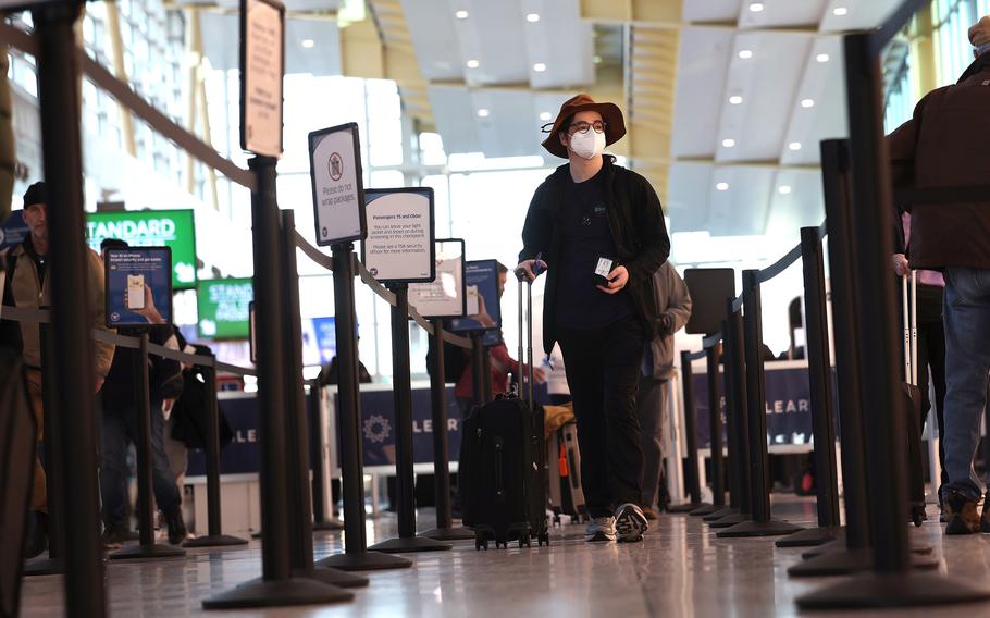 Passengers go through a security checkpoint at Ronald Reagan Washington National Airport on Nov. 22, 2022, in Arlington, Va.