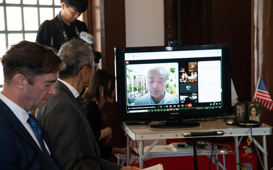 Wataru Satano, son of executioner Osamu Satano, speaks virtually during a ceremony.