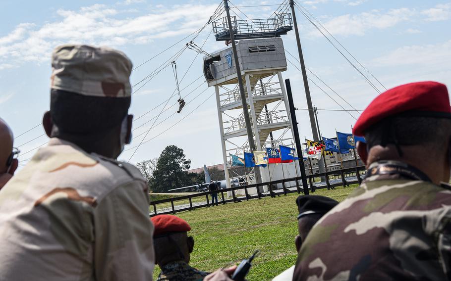 Top military officials from 40 African nations watch a U.S. Army Airborne School demonstration at Fort Benning, Ga., on March 22, 2022, during the U.S. Army’s African Land Forces Summit. The summit, held on U.S. ground for the first time, was meant to strengthen ties with allied and partner nations across the continent, U.S. officials said.