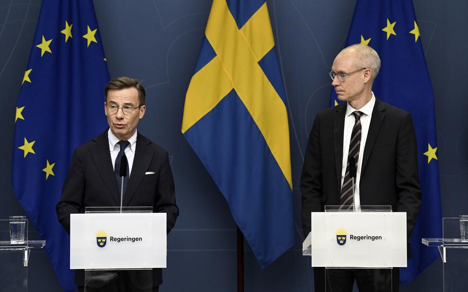 Sweden’s Prime Minister Ulf Kristersson, left, and Oscar Stenstroem, ambassador in the cabinet preparation and chief negotiator in the NATO process, hold a press briefing on the NATO process in Stockholm, Tuesday, March 14, 2023.