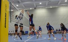 Ramstein senior Isabel Adkins, an outside hitter, goes up for the ball against a pair of Wiesbaden defenders in the semifinal round of the DODEA-Europe Division I girls’ volleyball championships on Saturday, Oct. 30, 2021, at the Ramstein High School gym in Germany. Wiesbaden beat Ramstein in two sets to play in the finals, where the Warriors lost to Stuttgart.