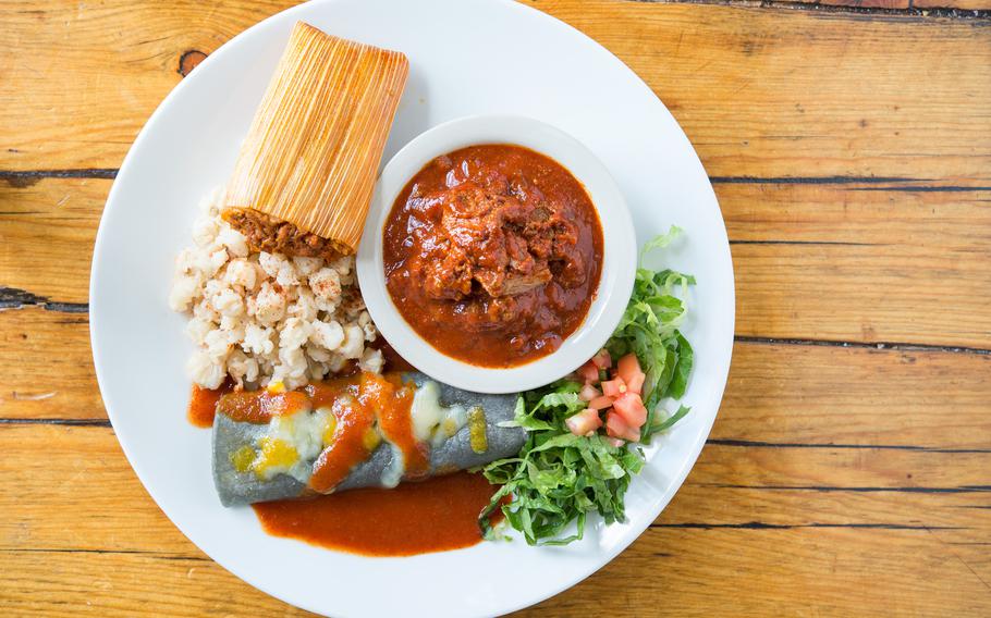 The “Combinación Picante” dish at Rancho de Chimayo: A combination plate with carne adovada, pork tamale, rolled blue corn cheese enchilada and posole served with red or green chile.  The restaurant is a half-hour drive from the city center. 