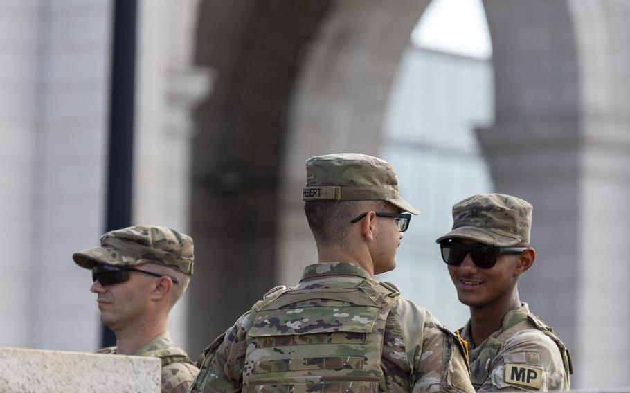Three soldiers seen from the shoulders up.