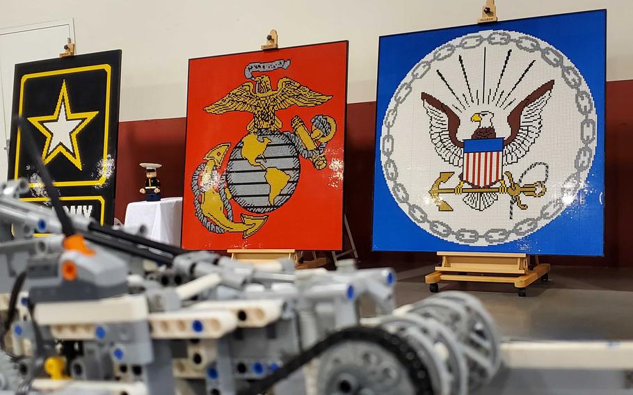 Three large LEGO mosaics.