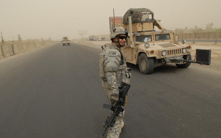 1st Lt. James Lienau pauses on his way back to his vehicle during a patrol in the Gazaliyah district of western Baghdad. Like others, Lienau sees the two-week period in late March when his unit left the area and later returned to find security holding as a key indication of growing confidence among the district’s residents.
