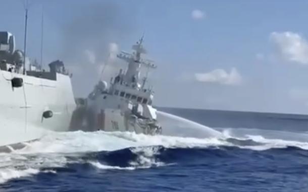 A blurry image of a ship crashing into a larger ship.