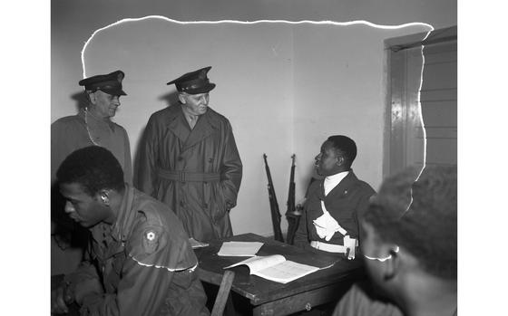 Lt. Gen. Clarence R. Huebner talks to one of the soldier-students - Pfc. Henry Spencer - in one of the classrooms at the Kitzingen Basic Training Center for Negro troops. The center - the Army’s only experimental school of its kind - expects to reach full operation by May 1 and eventually plans to train every Negro soldier in the EC, as well as any arriving as replacements. “There are 14,000,000 Negroes in the U.S.,” Huebner stated. “If the Nation is to utilize this manpower in the Army, we must develop its leadership potential.”  The U.S. Armed Forces were still segregated in January 1948. President Harry Truman’s executive order 9981 abolishing discrimination in the armed services “on the basis of race, color, religion or national origin,” which led to the end of segregation in the services, was issued July 26, 1948. 

Read the article and see additional photos of Lt. Gen. Huebner's visit here

META TAGS: Black History Month; African American; African American history; segregation; desegregation; U.S. Army; U.S. European Command; EUCOM; race relations; racism; military education; 