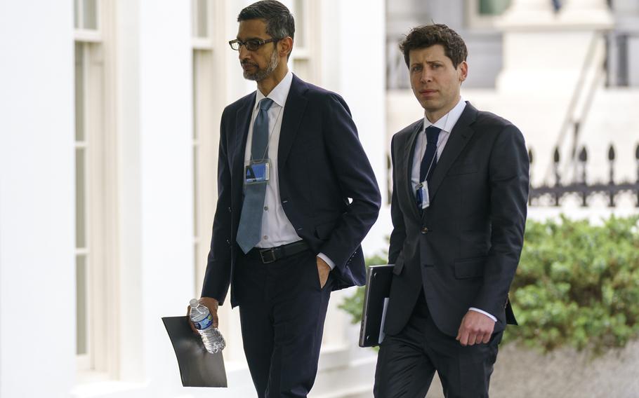 Alphabet CEO Sundar Pichai, left, and OpenAI CEO Sam Altman arrive to the White House for a meeting with Vice President Kamala Harris on artificial intelligence, Thursday, May 4, 2023, in Washington. As concerns grow over increasingly powerful artificial intelligence systems like ChatGPT, the nation’s financial watchdog says it’s working to ensure that companies follow the law when they’re using AI.
