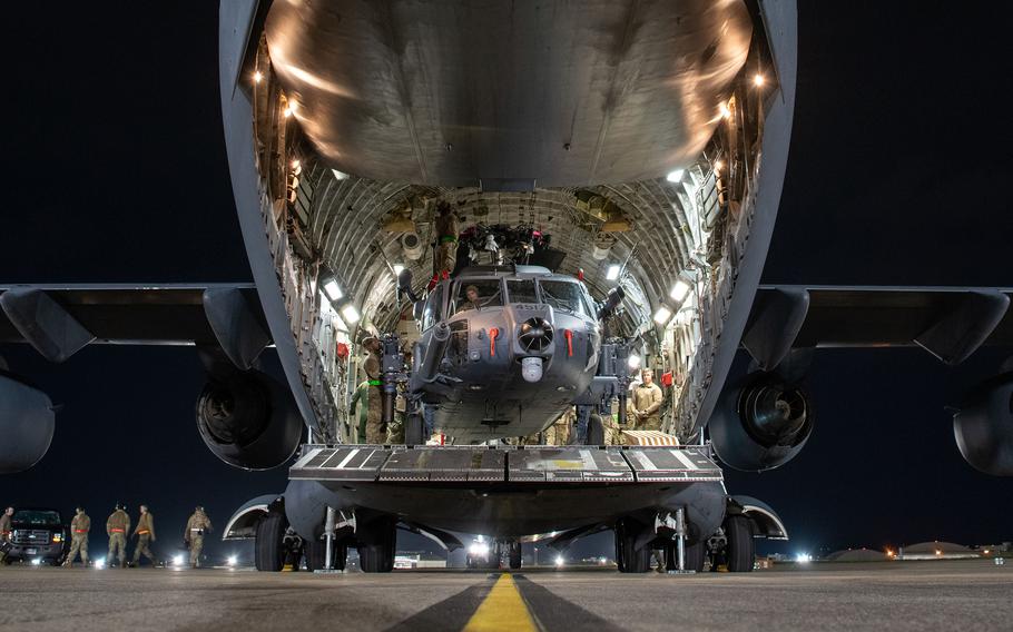 Service members offload two HH-60W Jolly Green IIs at Kadena Air Base, Okinawa, Jan. 26, 2024.