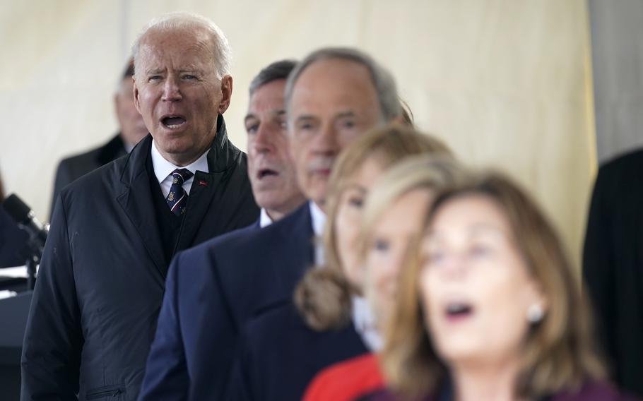 President Joe Biden sings "God Bless America" during a Memorial Day event at Veterans Memorial Park at the Delaware Memorial Bridge in New Castle, Del., Sunday, May 30, 2021.