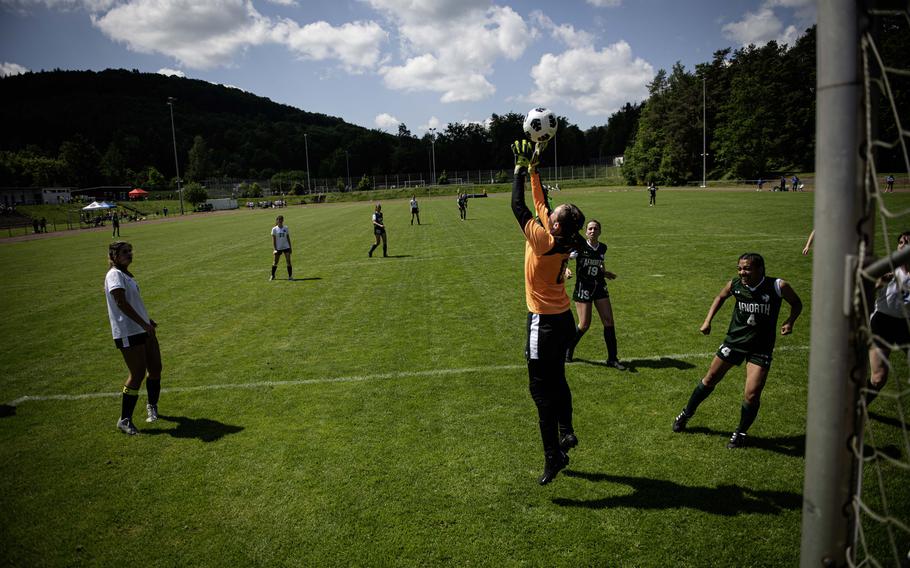 Brussels’ goalie jumps to grab a goal shot during the 2024 DODEA European Soccer Division III Championships in Landstuhl, Germany, on May 20, 2024. The shot slipped through her hands and was later scored by AFNORTH’s Maggie Masse.