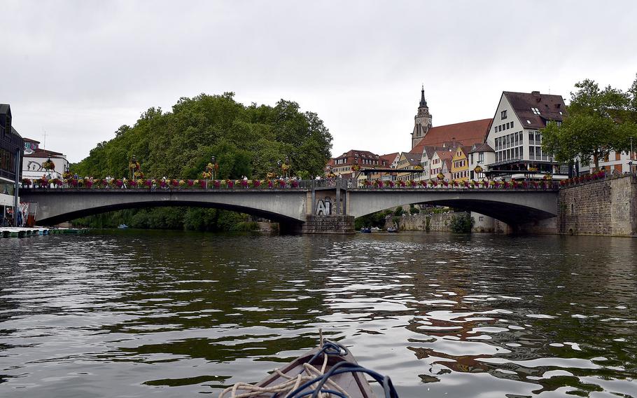 A scenic bridge over an urban riverway.
