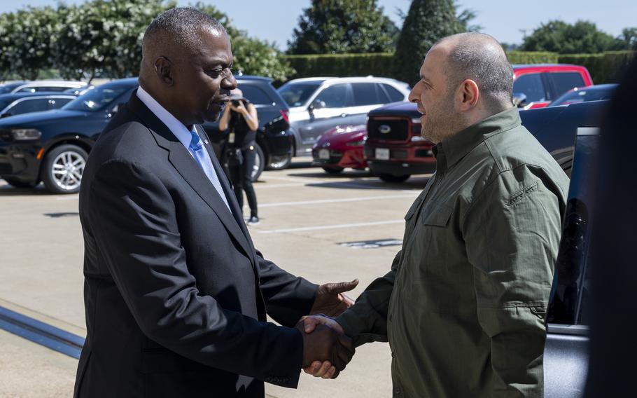 Defense Secretary Lloyd Austin greets Ukraine’s Defense Minister Rustem Umerov on Tuesday, July 2, 2024, during an arrival ceremony at the Pentagon.