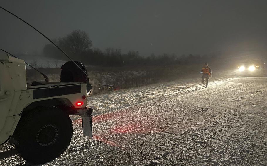 Guardsmen with the 338th Signal Company out of Elwood, helped a motorist who slid off the road on County Road 35 in Kokomo during Operation Snow Drift, on Thursday, Dec. 22, 2022. Hoosier service members across the state volunteered before the holidays to serve their communities during the blizzard.



(U.S. Army National Guard photo by Sgt. Hector Tinoco)